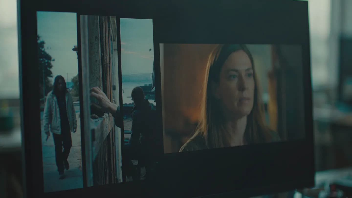 A video editing timeline on a dark monitor with cutaway clips arranged beside an interview track