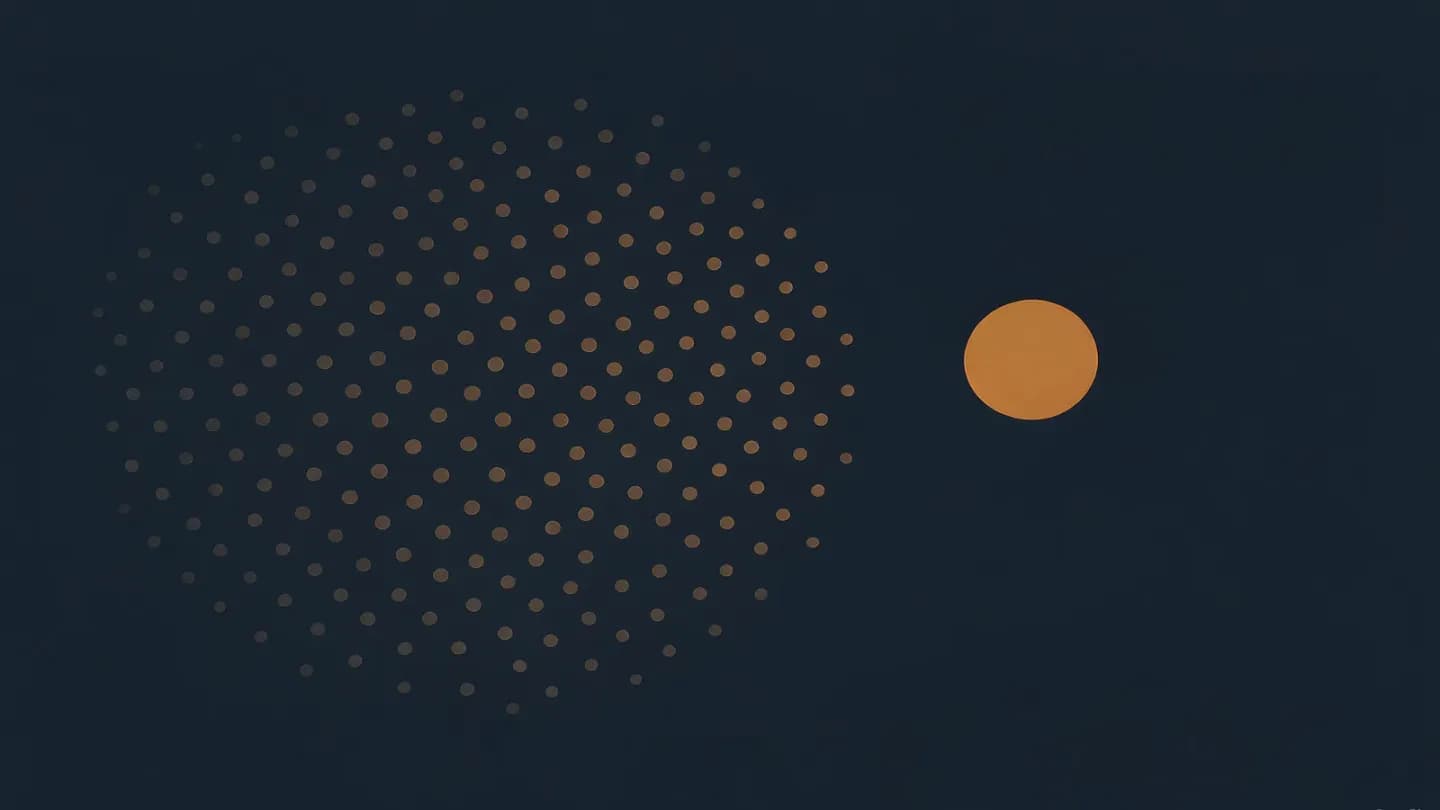 A large diffuse cloud of faint amber dots separated by a narrow gap from one small solid amber circle, on deep navy.