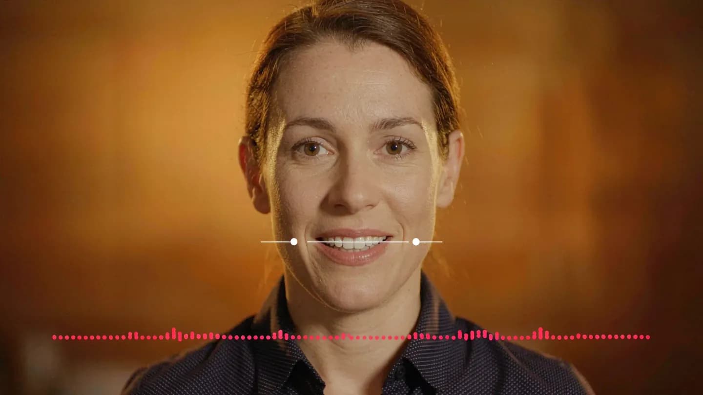 Waveform and lip-sync overlay on a generated spokesperson