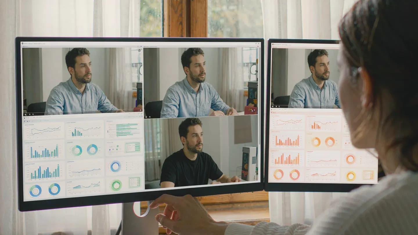 A marketing analyst comparing two near-identical video ads on a performance dashboard.