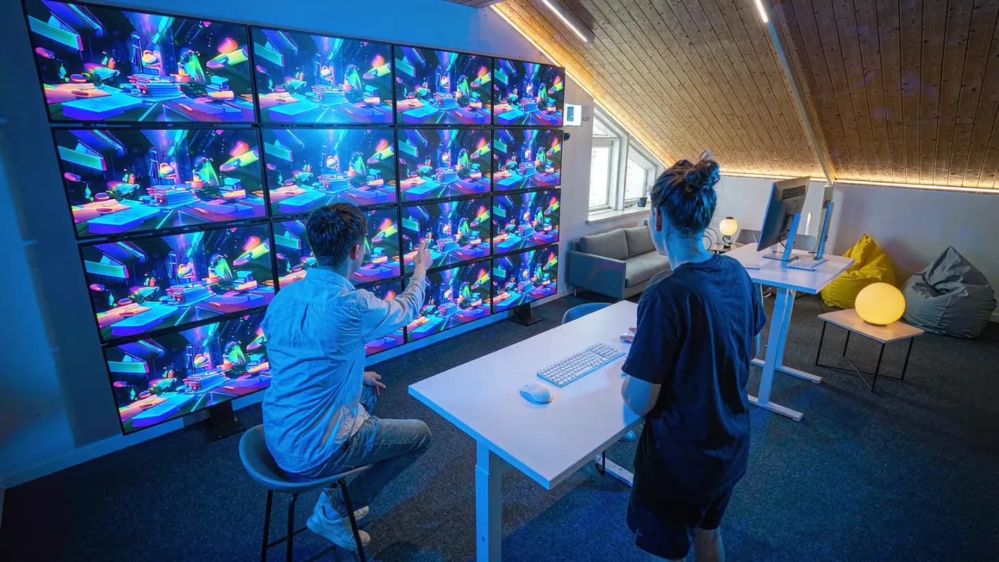 In-house studio pod editing AI-generated video on a wall of screens
