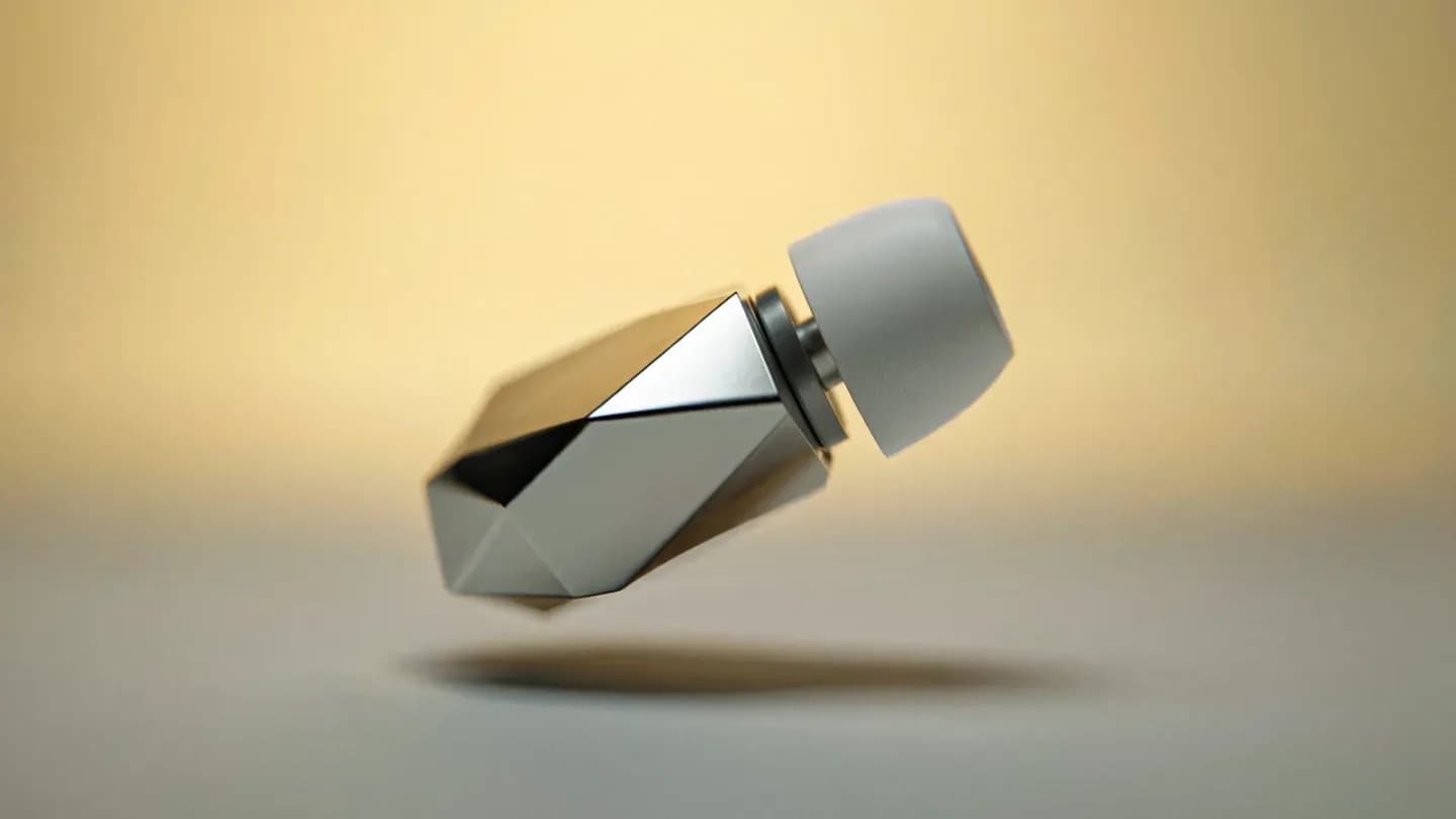 A minimalist gadget rotating into frame with a purposeful camera push-in