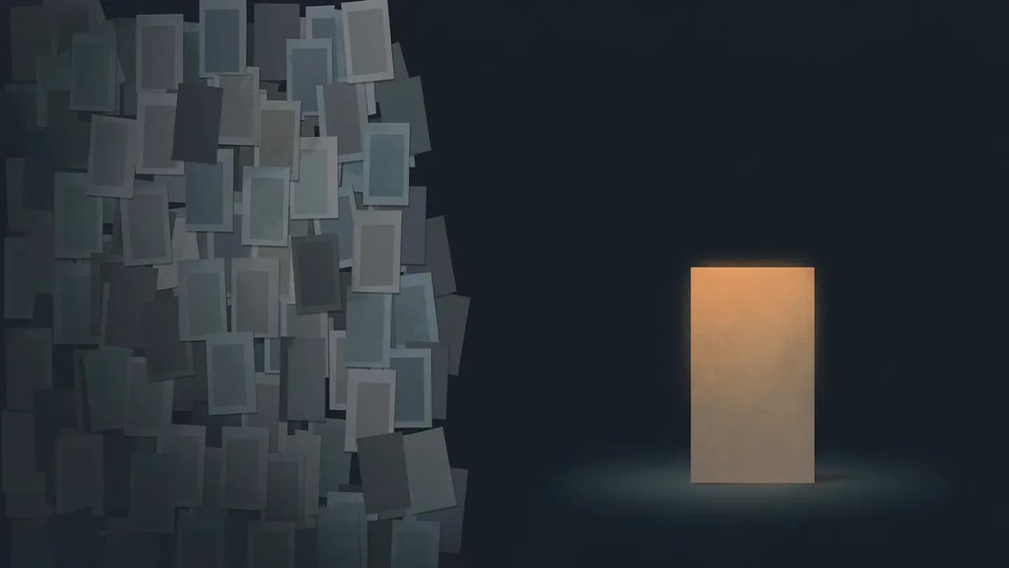 A dense dim stack of small garment cards on the left contrasts with one large amber-lit garment card standing alone on the right.